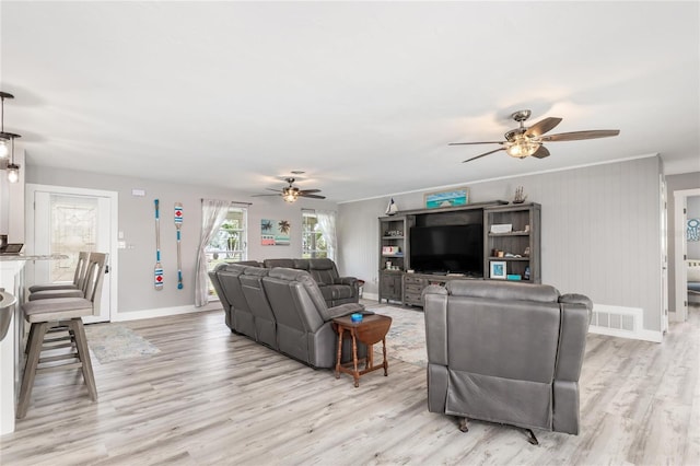 141 Baldwin Ct SE, Port Charlotte, FL 33952 - living room with ceiling fan and light wood-style floors