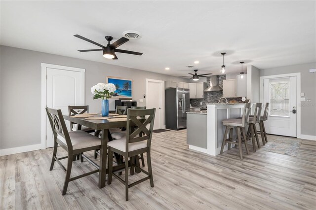 141 Baldwin Ct SE, Port Charlotte, FL 33952 - dining area with ceiling fan, light wood-type flooring, and recessed lighting