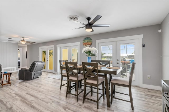 141 Baldwin Ct SE, Port Charlotte, FL 33952 - dining space featuring french doors, a ceiling fan, and light wood-type flooring