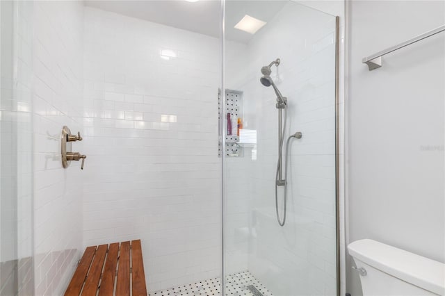 141 Baldwin Ct SE, Port Charlotte, FL 33952 - bathroom featuring a tile shower and toilet