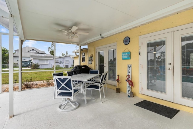 141 Baldwin Ct SE, Port Charlotte, FL 33952 - view of patio with french doors, outdoor dining area, and ceiling fan