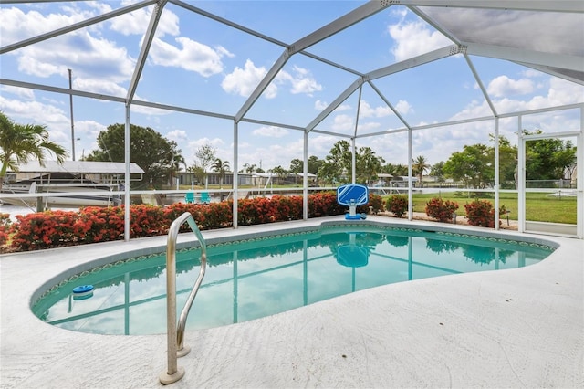 141 Baldwin Ct SE, Port Charlotte, FL 33952 - swimming pool with glass enclosure and a patio