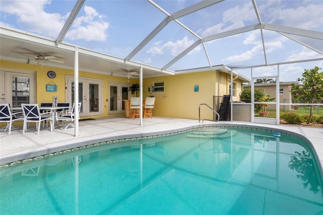 141 Baldwin Ct SE, Port Charlotte, FL 33952 - swimming pool featuring ceiling fan, french doors, a patio, and glass enclosure