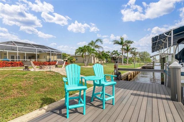 141 Baldwin Ct SE, Port Charlotte, FL 33952 - wooden terrace with a dock, boat lift, and a yard