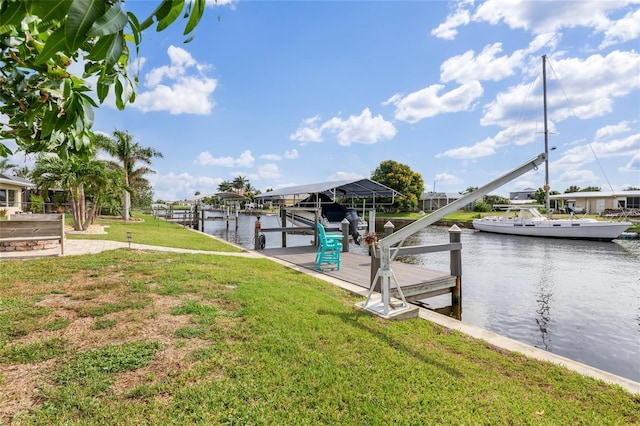 141 Baldwin Ct SE, Port Charlotte, FL 33952 - dock area with a water view, a yard, and boat lift