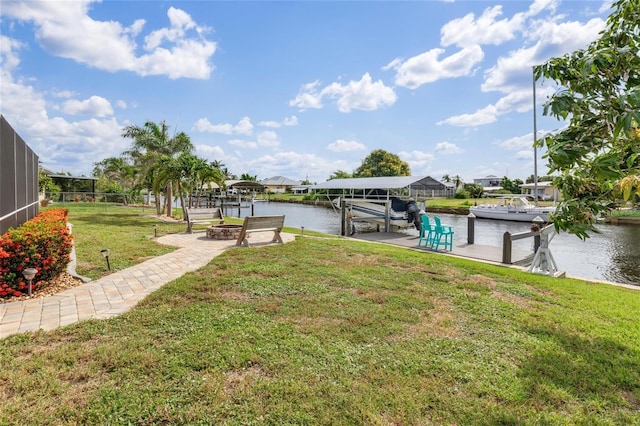141 Baldwin Ct SE, Port Charlotte, FL 33952 - dock with a water view, a lawn, and boat lift