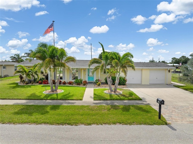 141 Baldwin Ct SE, Port Charlotte, FL 33952 - view of front of property featuring driveway, an attached garage, a front lawn, and stucco siding