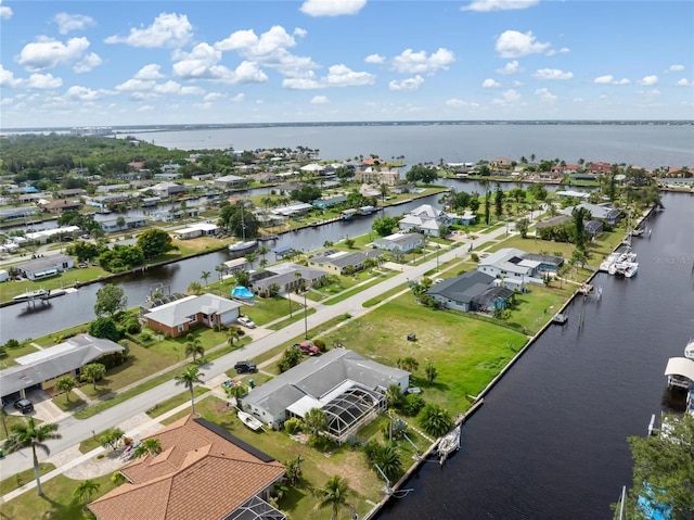 141 Baldwin Ct SE, Port Charlotte, FL 33952 - aerial perspective of suburban area featuring a large body of water