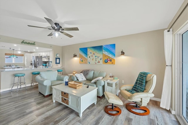 1401 S Mccall Rd Unit 205B, Englewood, FL 34223 - living area featuring light wood-style floors and a ceiling fan