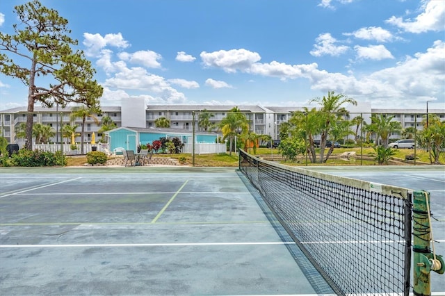 1401 S Mccall Rd Unit 205B, Englewood, FL 34223 - view of tennis court with a residential view