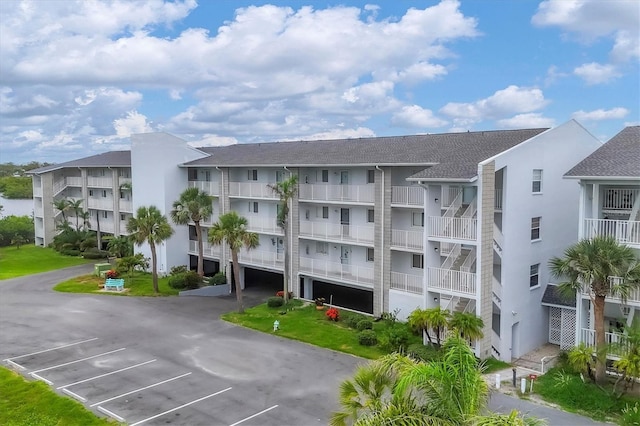 1401 S Mccall Rd Unit 205B, Englewood, FL 34223 - view of apartment building / complex featuring uncovered parking