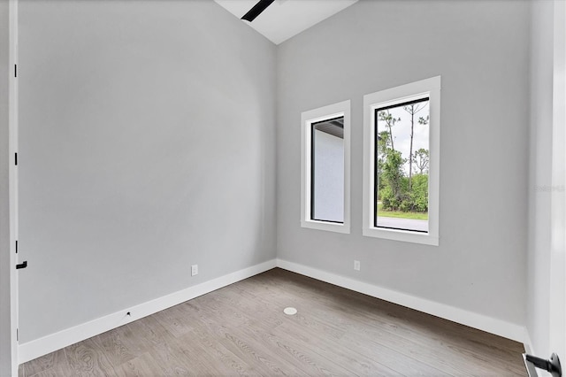 14089 Wenzel Ave, Port Charlotte, FL 33981 - unfurnished room with baseboards and wood finished floors