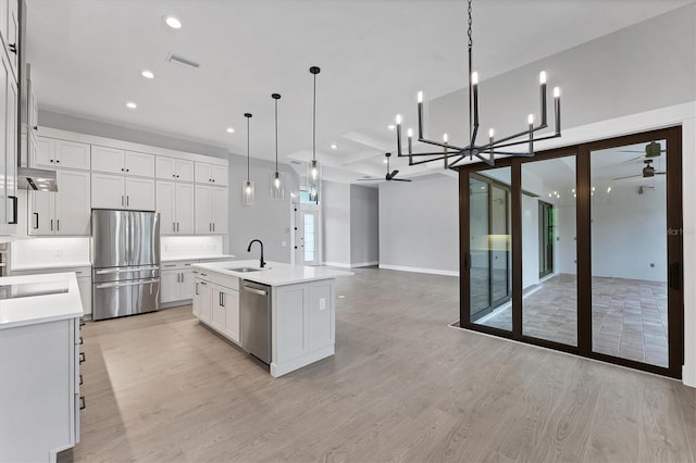 14089 Wenzel Ave, Port Charlotte, FL 33981 - kitchen with appliances with stainless steel finishes, a ceiling fan, light wood-style flooring, recessed lighting, and open floor plan