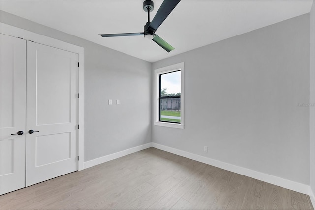 14089 Wenzel Ave, Port Charlotte, FL 33981 - unfurnished bedroom featuring wood finished floors, a closet, and ceiling fan