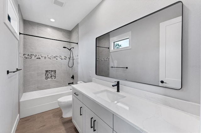 14089 Wenzel Ave, Port Charlotte, FL 33981 - full bathroom featuring vanity, wood finished floors, and bathing tub / shower combination