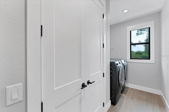 14089 Wenzel Ave, Port Charlotte, FL 33981 - laundry room featuring washing machine and clothes dryer, light wood finished floors, and recessed lighting