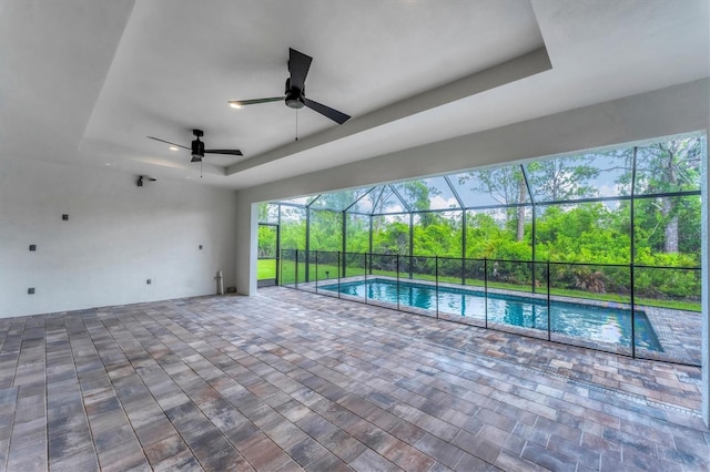 14089 Wenzel Ave, Port Charlotte, FL 33981 - outdoor pool featuring ceiling fan, a patio area, and glass enclosure