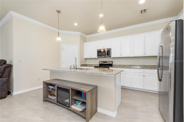 14756 Ponce De Leon Trl, Port Charlotte, FL 33981 - kitchen featuring stainless steel appliances, crown molding, white cabinets, light stone counters, and recessed lighting
