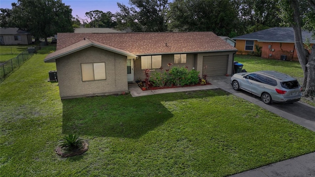 7580 Hanchey St, North Port, FL 34287 - ranch-style home with asphalt driveway, a garage, stucco siding, and a shingled roof