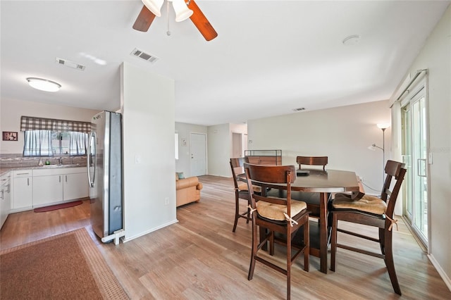7580 Hanchey St, North Port, FL 34287 - dining room with light wood-style flooring and ceiling fan