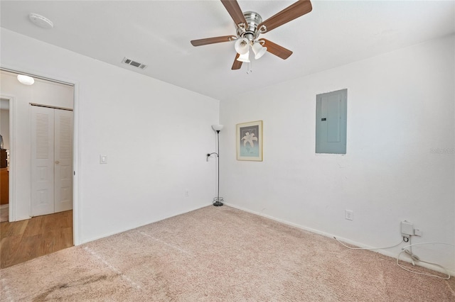 7580 Hanchey St, North Port, FL 34287 - empty room with electric panel, carpet, ceiling fan, and a smoke detector