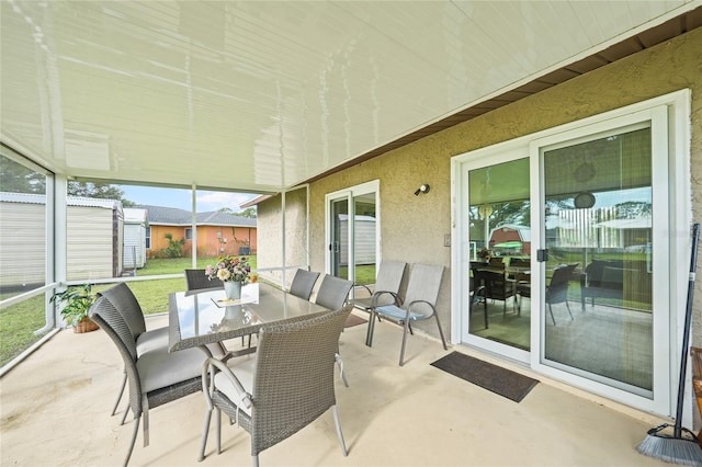 7580 Hanchey St, North Port, FL 34287 - sunroom featuring outdoor dining area