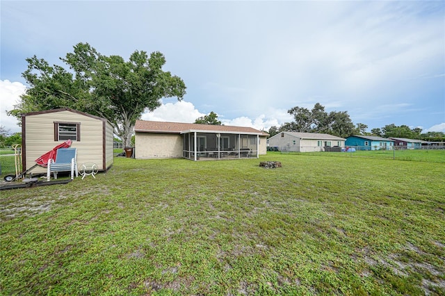 7580 Hanchey St, North Port, FL 34287 - view of yard featuring a sunroom and a storage unit