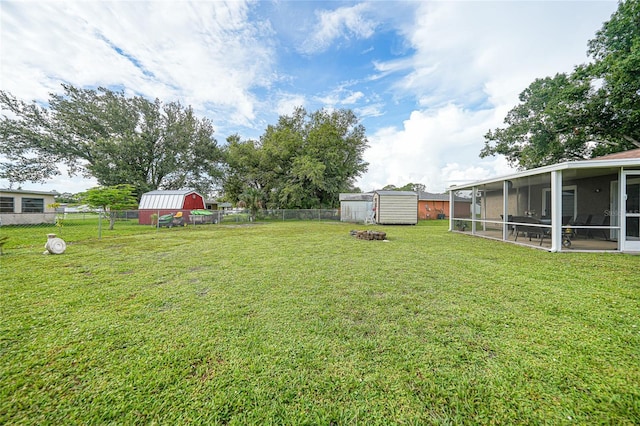 7580 Hanchey St, North Port, FL 34287 - fenced backyard featuring a storage shed and a sunroom