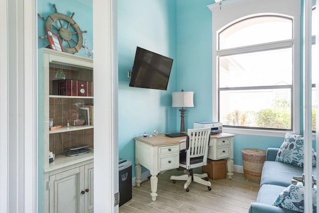 1131 Rotonda Cir, Rotonda West, FL 33947 - office featuring plenty of natural light and light wood-style flooring