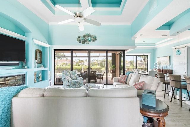 1131 Rotonda Cir, Rotonda West, FL 33947 - living area with coffered ceiling, ornamental molding, a ceiling fan, wood finished floors, and a towering ceiling
