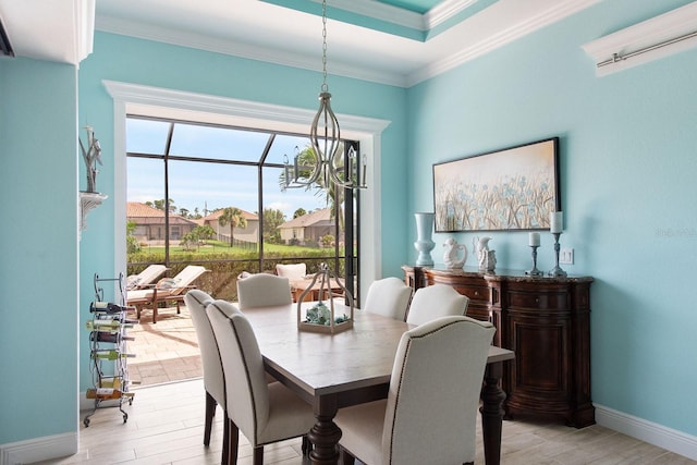 1131 Rotonda Cir, Rotonda West, FL 33947 - dining area featuring light wood finished floors and crown molding