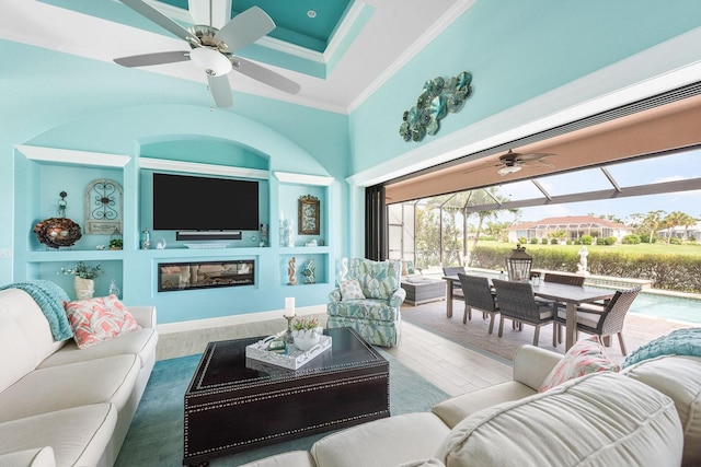 1131 Rotonda Cir, Rotonda West, FL 33947 - living area featuring a ceiling fan, wood finished floors, crown molding, and built in shelves