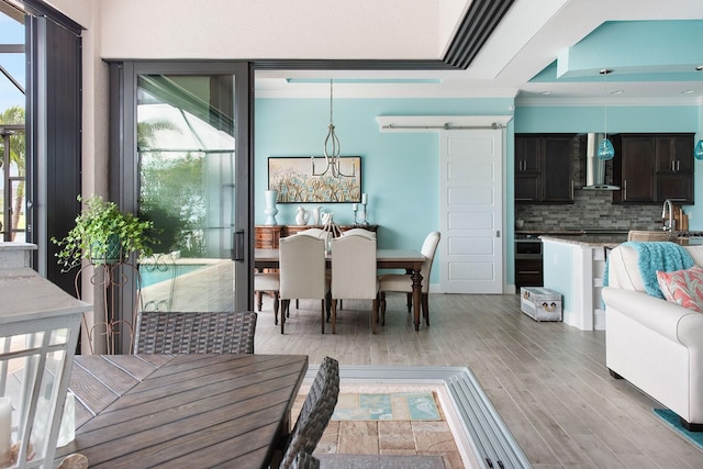 1131 Rotonda Cir, Rotonda West, FL 33947 - dining room featuring crown molding and light wood-style floors