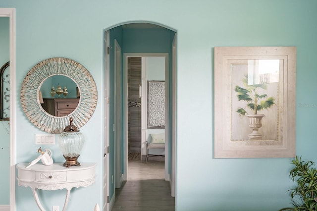 1131 Rotonda Cir, Rotonda West, FL 33947 - corridor featuring arched walkways and wood finished floors