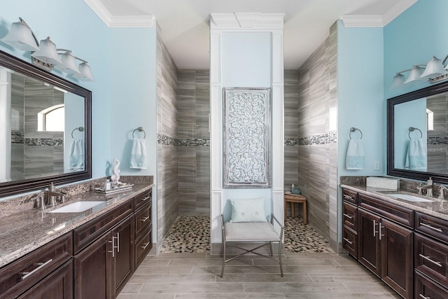 1131 Rotonda Cir, Rotonda West, FL 33947 - bathroom with ornamental molding, two vanities, a walk in shower, and wood finished floors