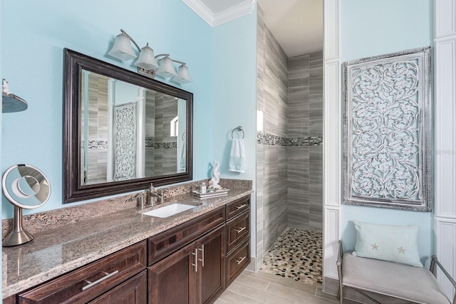 1131 Rotonda Cir, Rotonda West, FL 33947 - bathroom with tiled shower, vanity, and ornamental molding