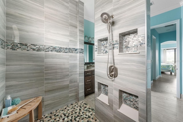 1131 Rotonda Cir, Rotonda West, FL 33947 - ensuite bathroom with tile walls, tiled shower, and vanity