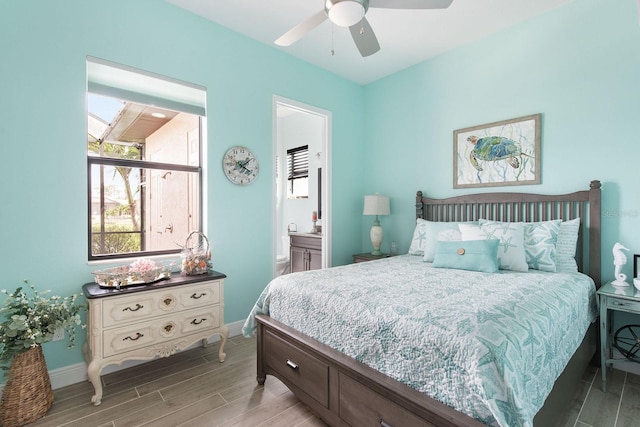 1131 Rotonda Cir, Rotonda West, FL 33947 - bedroom featuring wood tiled floors, connected bathroom, and ceiling fan