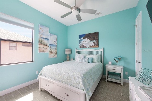 1131 Rotonda Cir, Rotonda West, FL 33947 - bedroom featuring wood tiled floors and ceiling fan