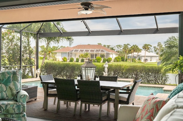 1131 Rotonda Cir, Rotonda West, FL 33947 - view of patio / terrace with an outdoor pool, glass enclosure, ceiling fan, and outdoor dining area