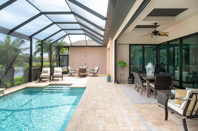 1131 Rotonda Cir, Rotonda West, FL 33947 - outdoor pool with a patio, a ceiling fan, glass enclosure, and outdoor dining space
