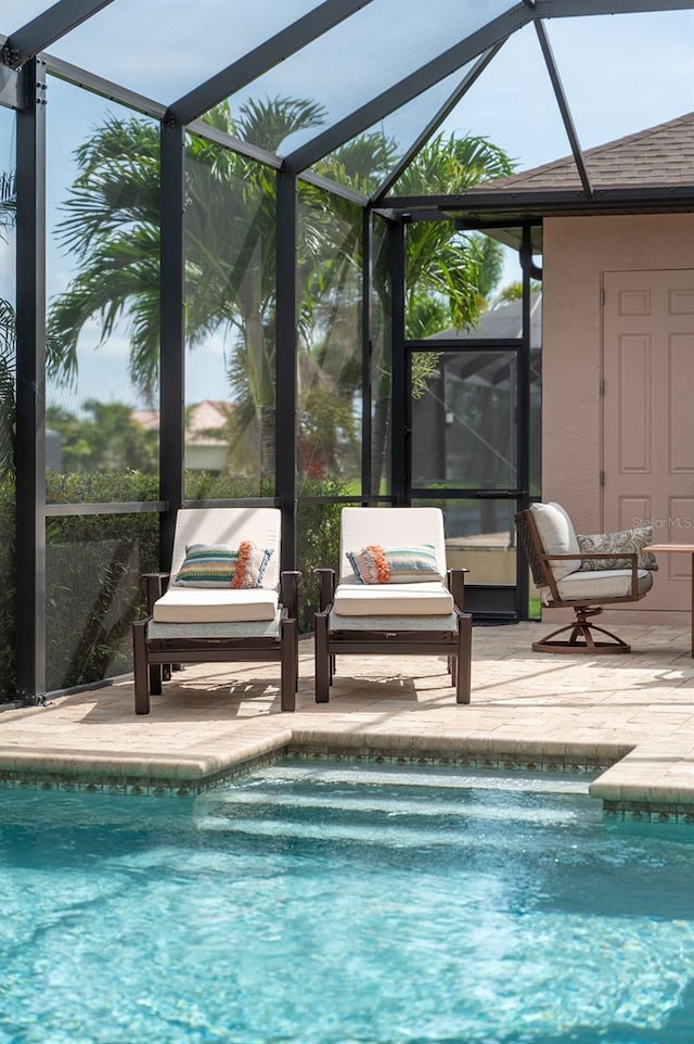 1131 Rotonda Cir, Rotonda West, FL 33947 - swimming pool featuring glass enclosure and a patio area