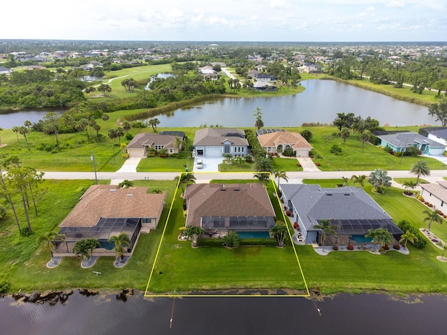 1131 Rotonda Cir, Rotonda West, FL 33947 - aerial perspective of suburban area featuring property boundaries highlighted and a large body of water