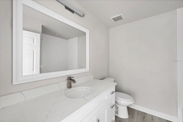 234 Boundary Blvd Unit 3, Rotonda West, FL 33947 - bathroom with vanity and wood finished floors