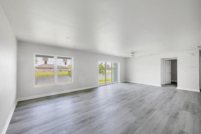 234 Boundary Blvd Unit 3, Rotonda West, FL 33947 - unfurnished living room featuring ceiling fan and wood finished floors