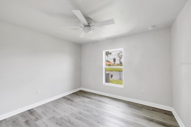 234 Boundary Blvd Unit 3, Rotonda West, FL 33947 - spare room with ceiling fan, wood finished floors, and a smoke detector