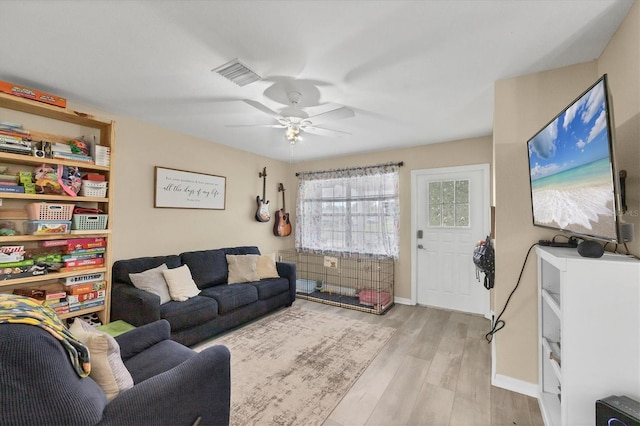 7590 Lyncrest St, North Port, FL 34287 - living room with wood finished floors and ceiling fan