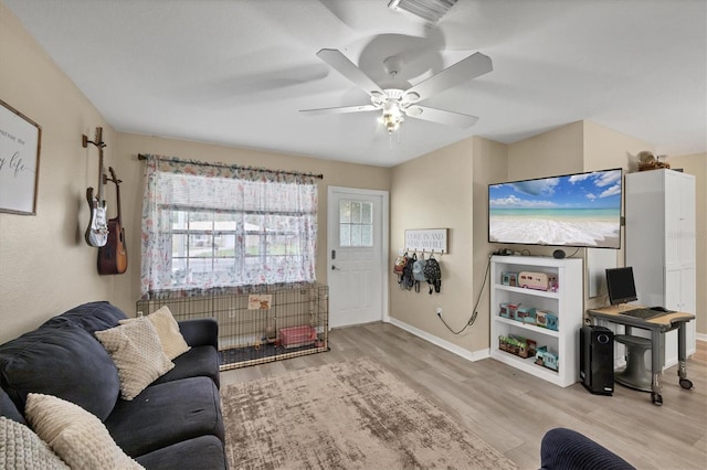 7590 Lyncrest St, North Port, FL 34287 - living room featuring plenty of natural light, wood finished floors, and ceiling fan