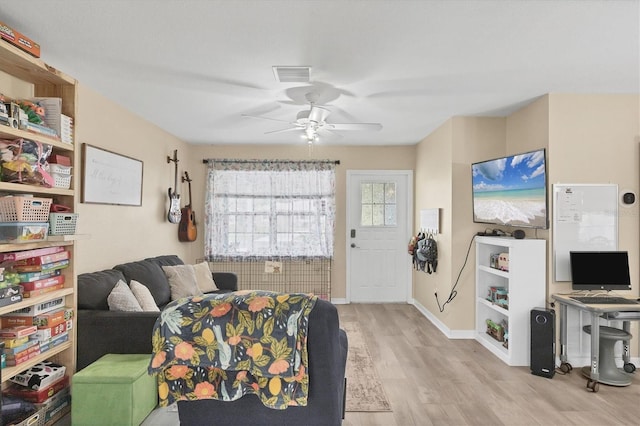 7590 Lyncrest St, North Port, FL 34287 - living room featuring wood finished floors and ceiling fan