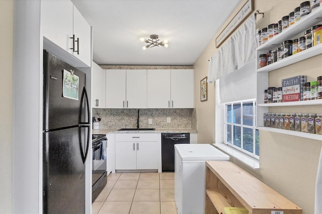 7590 Lyncrest St, North Port, FL 34287 - kitchen featuring black appliances, decorative backsplash, white cabinetry, and light tile patterned flooring